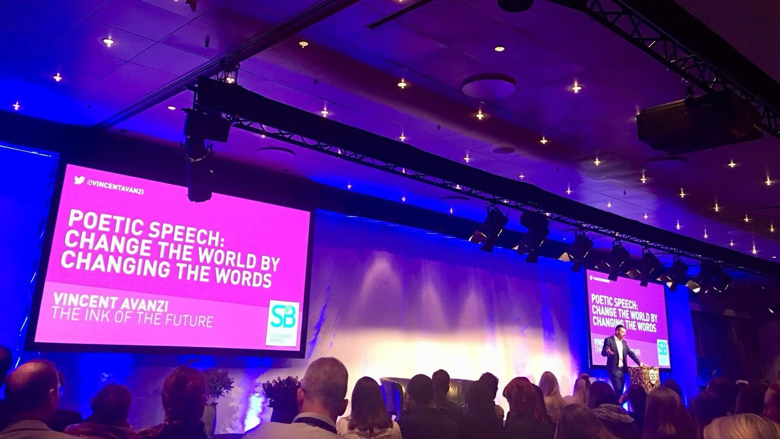 Vincent Avanzi delivering a poetic speech at an international business event